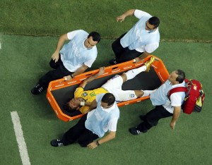 Brazil's Neymar grimaces as he is carried off the pitch after being injured during their 2014 World Cup quarter-finals against Colombia at the Castelao arena in Fortaleza